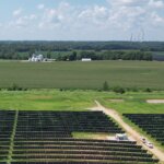 Solar panels next to farm land