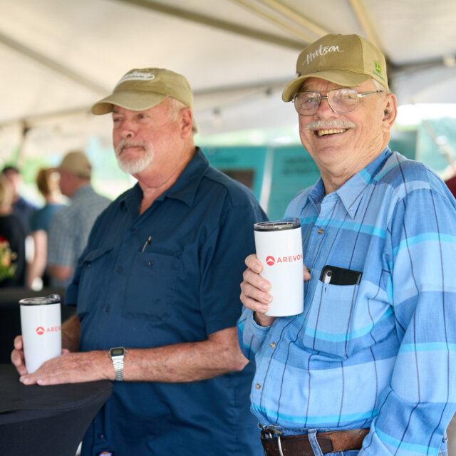 Arevon landowners holding tumbler with Arevon logo